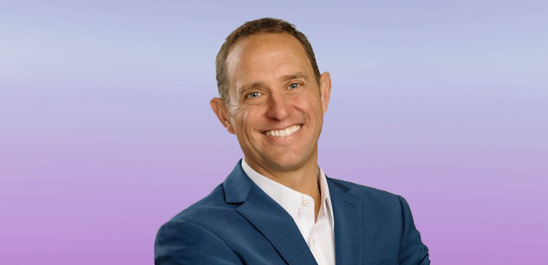 ASCD author Scott Ervin, a white man with short hair and wearing a blue blazer and white button down shirt superimposed over a colorful background.