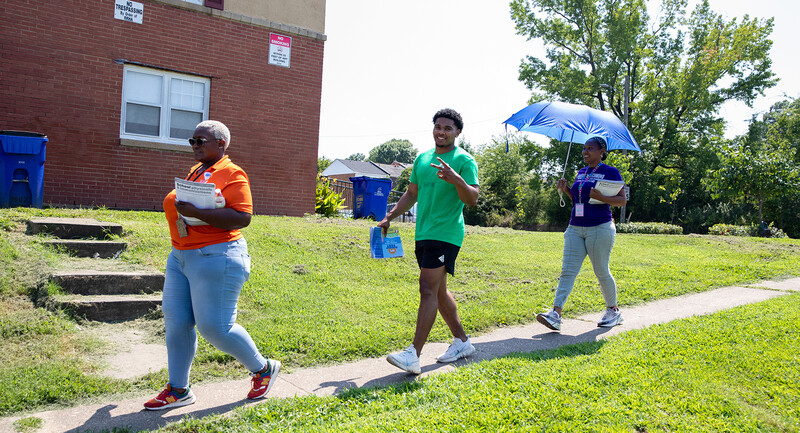 RPS family liaisons visit residents during a Community Walk, a neighborhood engagement event aimed at building strong relationships and trust between families and schools.