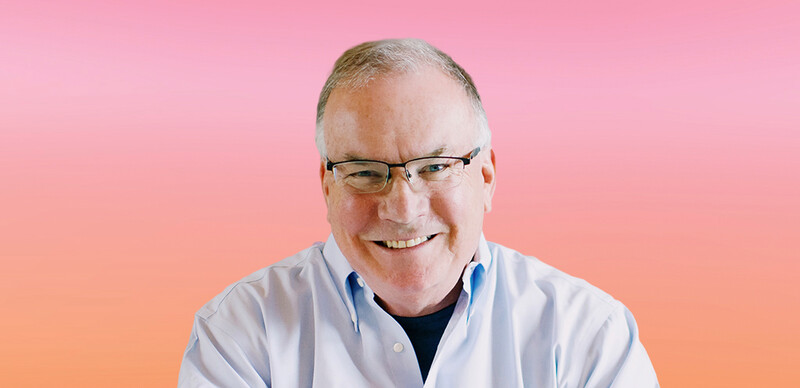 ASCD Author Jim Knight, a smiling White man with gray hair wearing glasses and a light blue shirt.